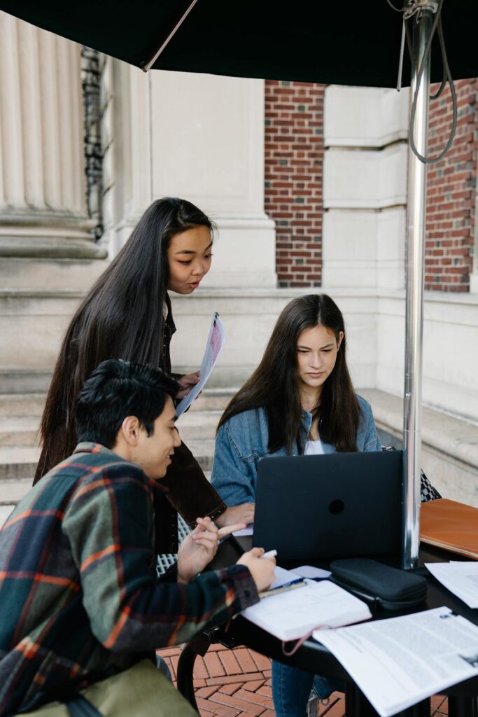 Students and young employees collaborating with employers during workforce planning discussions in a modern Canadian workplace